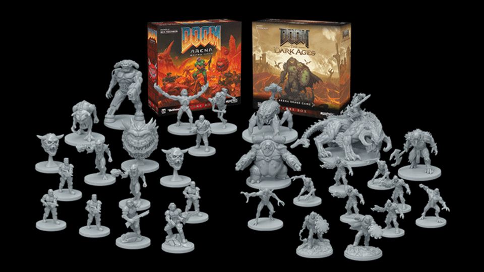Miniatures of both versions on display, including multiple demon models from the DOOM franchise.