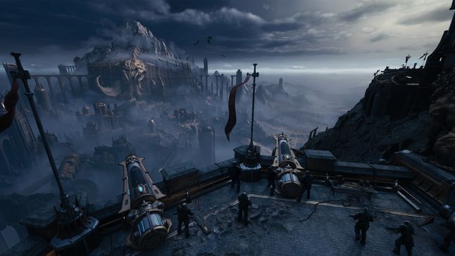 A cannon emplacement overlooks a war-torn village