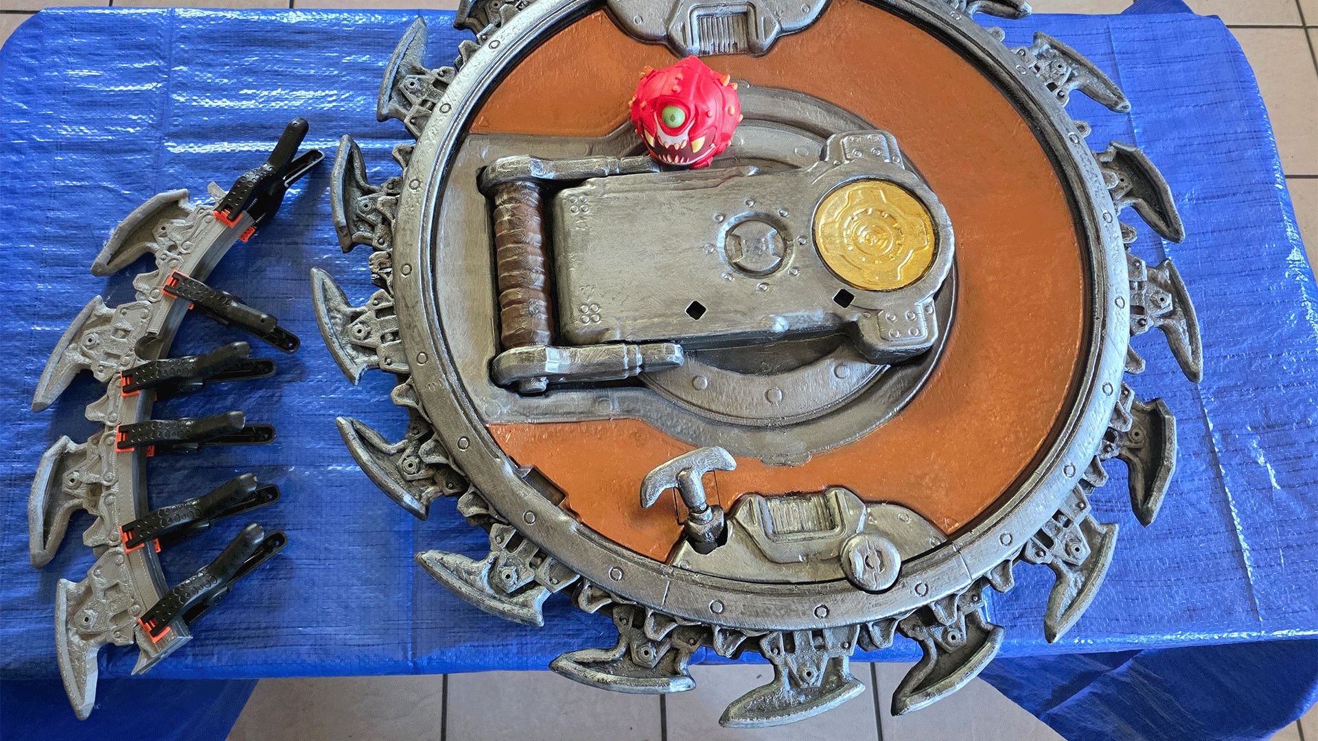 Adding the sawblades to the Shield's frame.