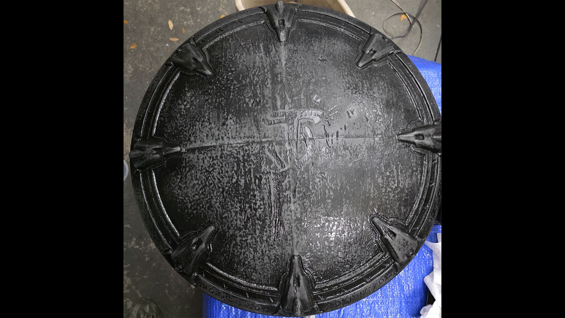 The front of the Shield Saw, primed with some drybrushing applied.