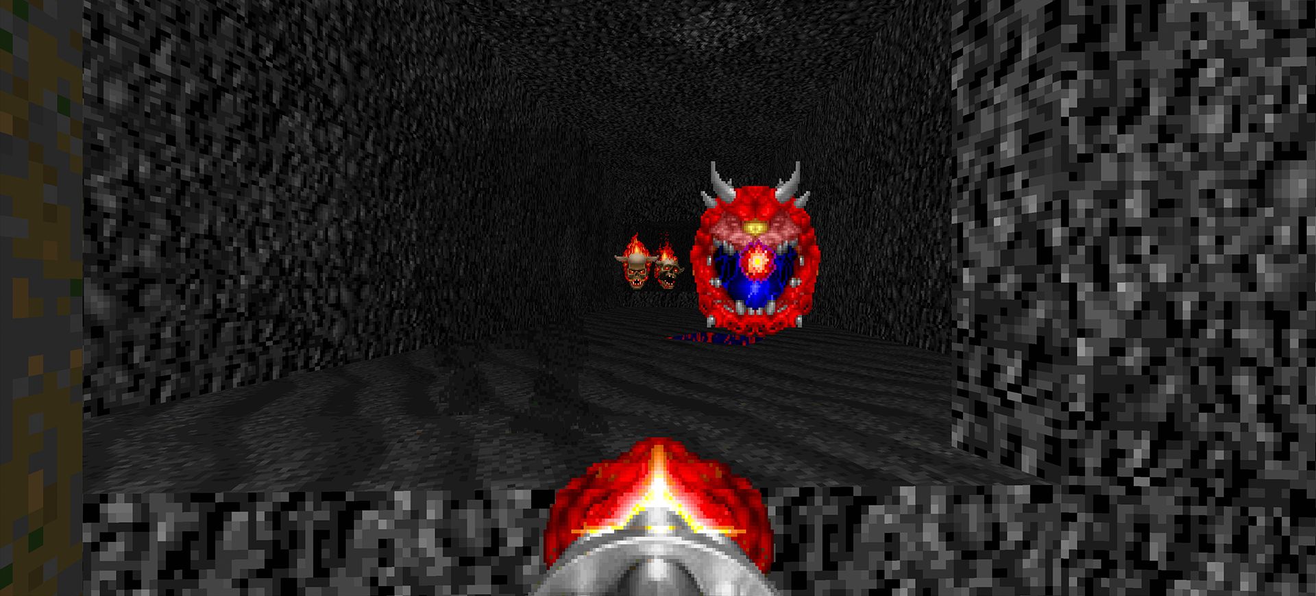 The player fires their Minigun at a flying Cacodemon